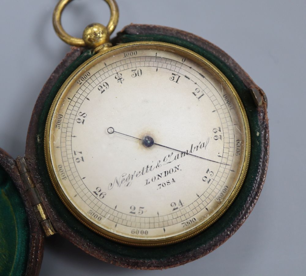 A Negretti and Zambra gilt metal cased pocket barometer